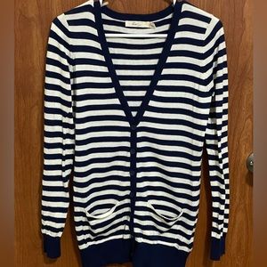 White and navy striped long-sleeve buttoned cardigan.